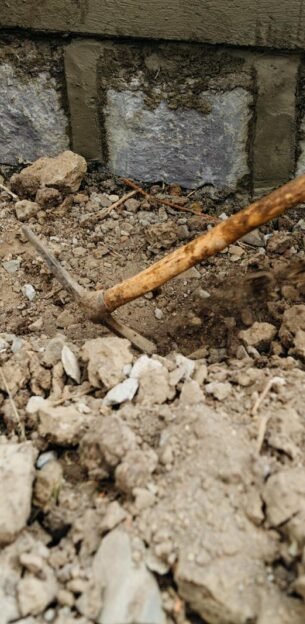 People Digging Using Shovel and Pickaxe